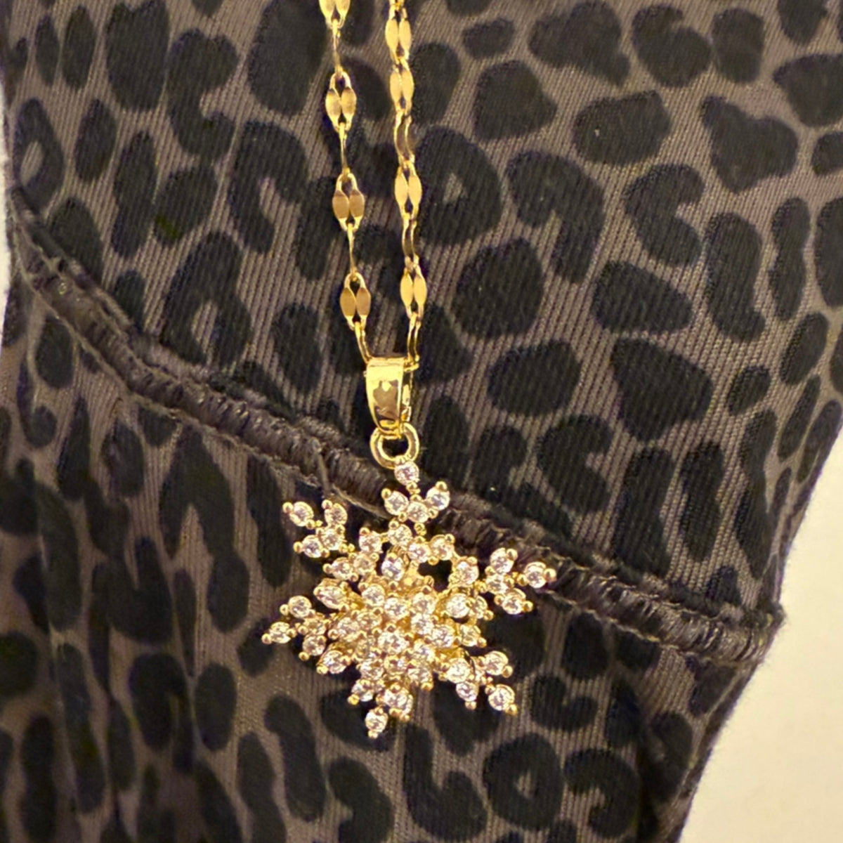 Golden Spinning Snowflake Necklace